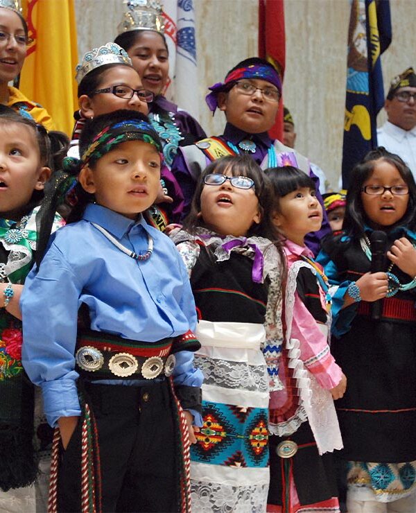 Children from the Zuni Pueblo lead the U.S. pledge of allegiance in the Zuni language in the New Mexico state Capitol in Santa Fe, N.M.