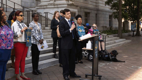 Michael Perloff speaking at the press conference for Crisis Response
