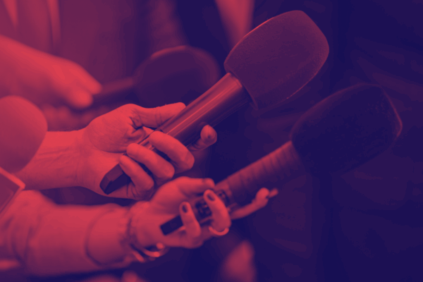 Red and dark blue overlay of hands hold microphones