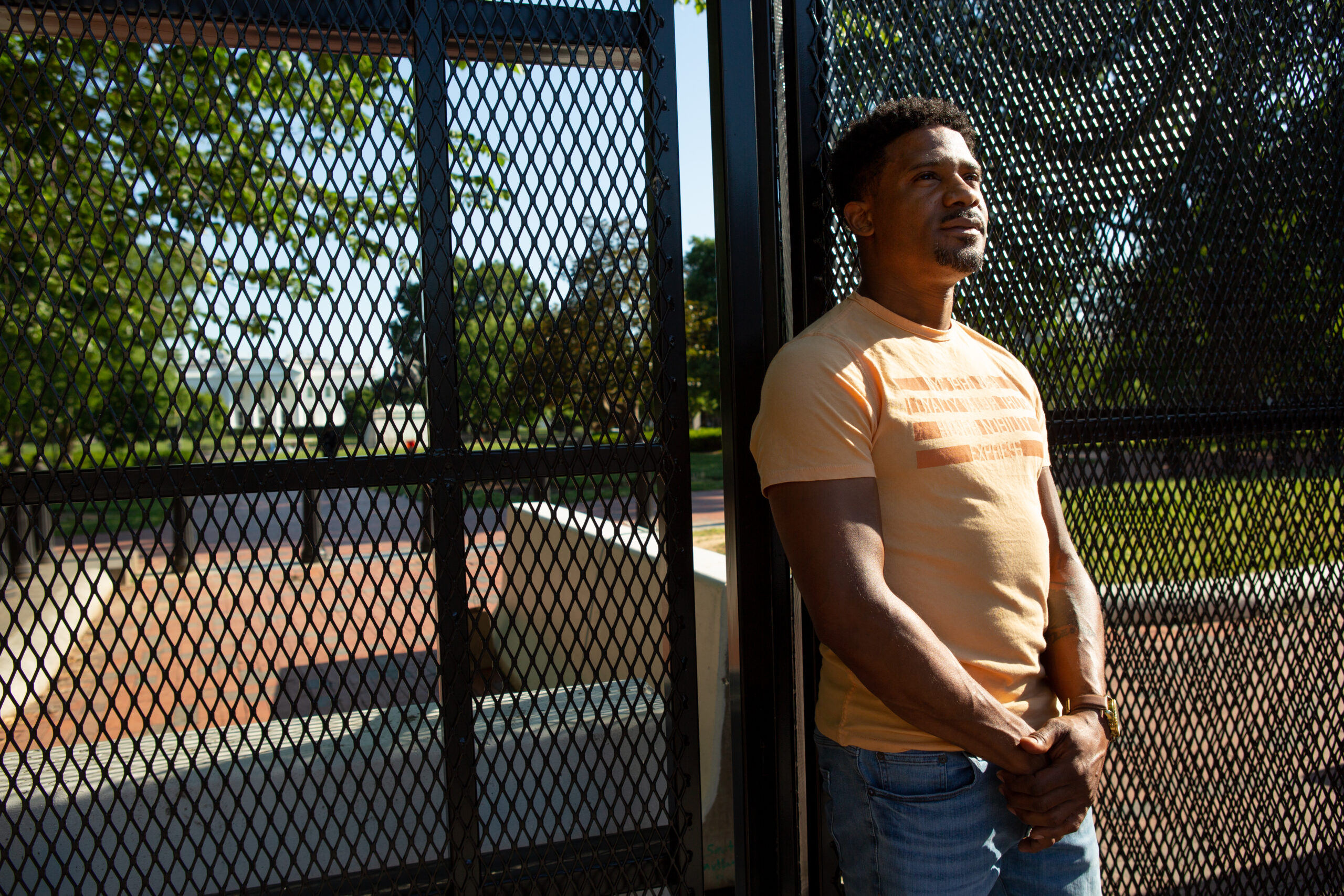 Kishon McDonald standing in front of a gate.