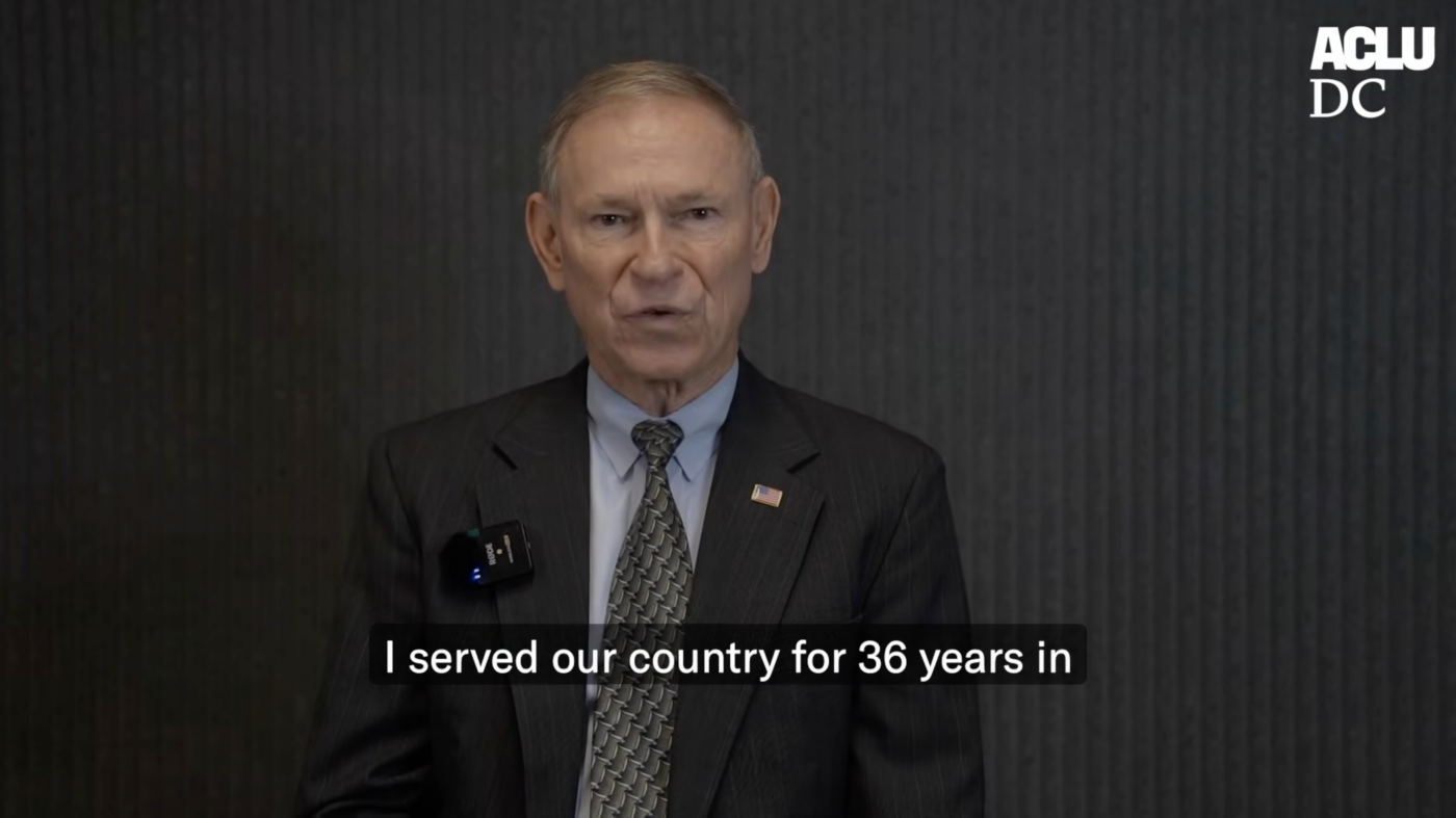 Retired Major General Randy Manner pictured wearing a grey suit, a gray tie, and an American Flag pin.