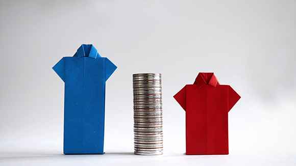 image of and blue shirt and a red shirt next to a stack of coins, representing the gender wage gap