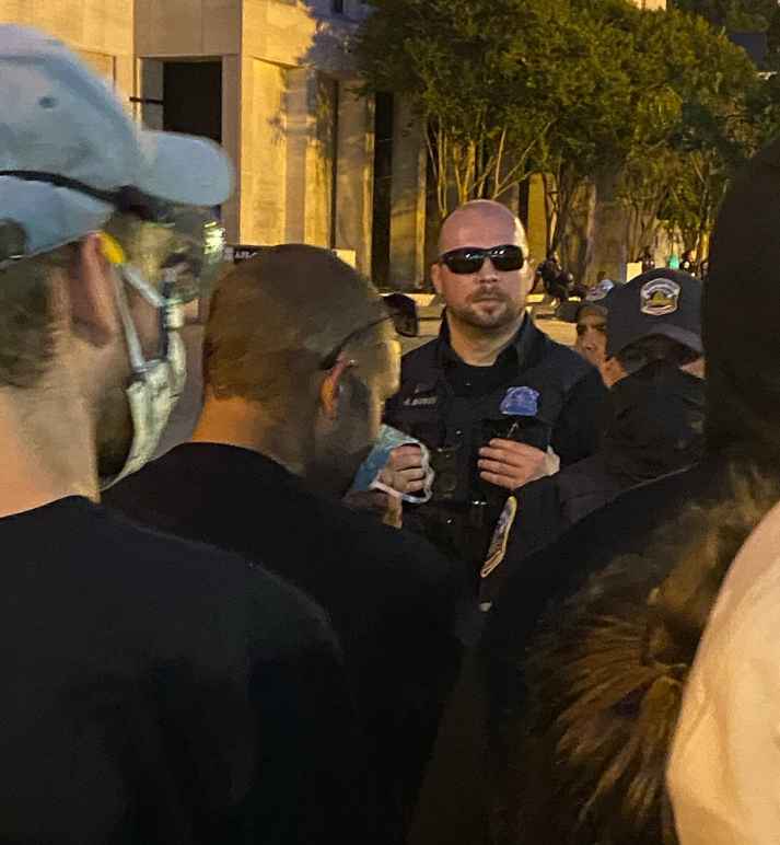 photo of DC Police officer without mask at protest