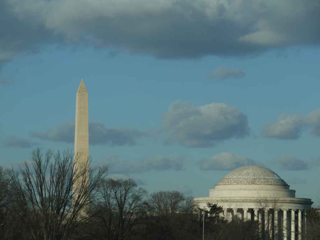 Image of the Washington and the Jefferson Monuments against a blue sky with clouds