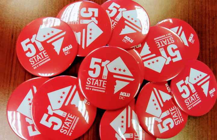 red statehood buttons that read 51st State