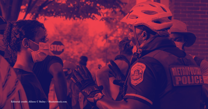 Police officer and person in mask