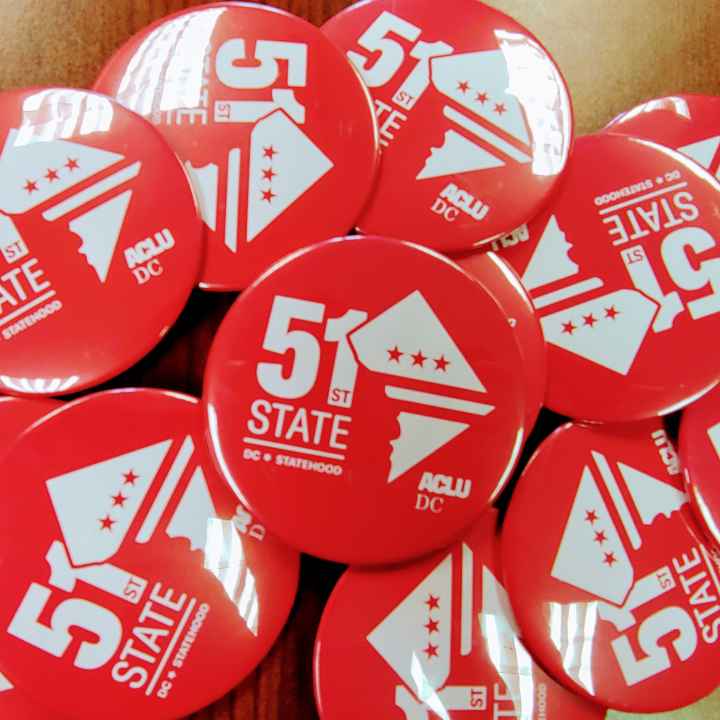 red statehood buttons that read 51st State