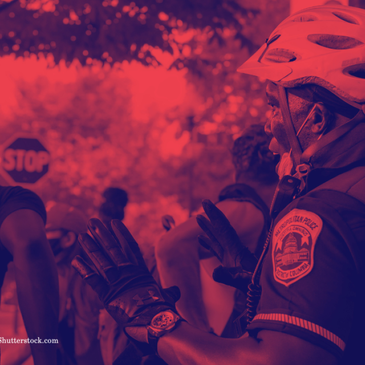 Police officer and person in mask